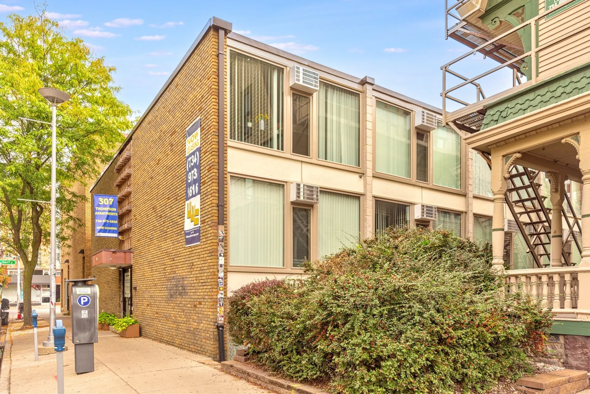 hero_campus_307_Thompson 307 apartment complex exterior shot side angle.